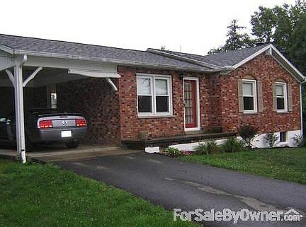 Front of House with Carport