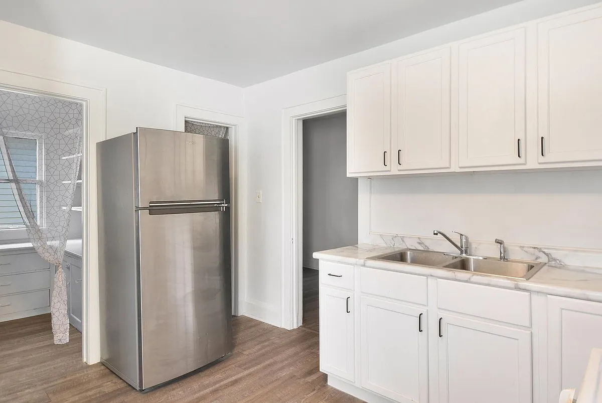 Kitchen featuring two spacious pantries for extra storage. - 1534 N Marshall St #UPPER