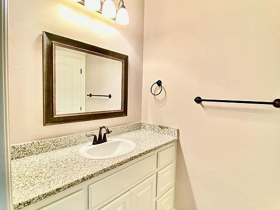 Mother in Law suite with full bath and 2nd vanity and storage.