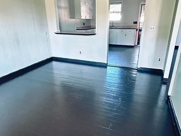 Living room with bar opening to kitchen