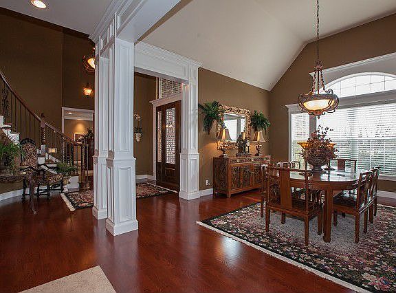Elegant staircase, wood floors and soaring ceilings!