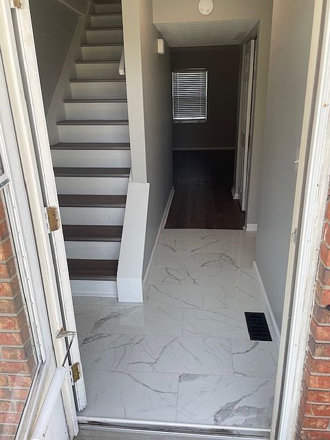 Front door view brand new tiled