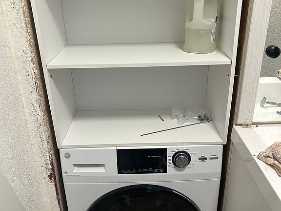 Washer dryer combo (I just installed the shelves and will be adding trim to the gaps.