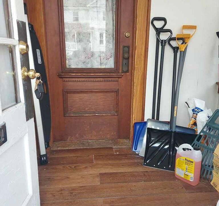 Front entryway/mudroom, there is an ascending corner stairway to the living space