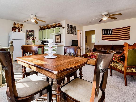 An open room concept for the living room, dining area and kitchen make for an open and airy space.