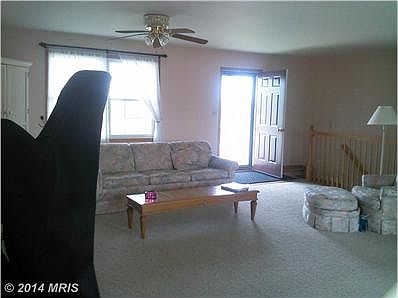 Living room from dining area toward front door