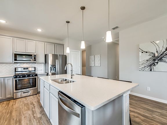 Abundant cabinet space in kitchen model representation