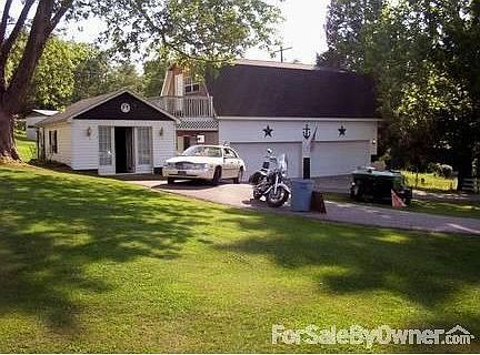 Oversized 4 car garage has STAGE & Apt