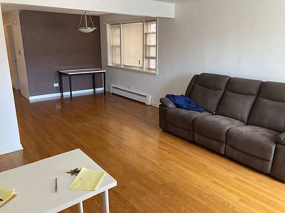 Living room with view into dining room