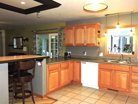 Newer cabinets and counters in the kitchen.