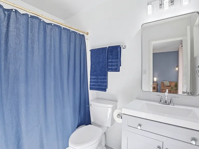 Private bathroom with tub/shower combo.