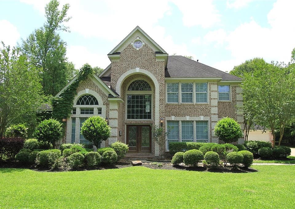 Stunning, Custom Four Bedroom Home features Many Upgrades and Boasts Two Separate Three Car Garages and is Situated on a Large Lot with a Beautiful Landscape.