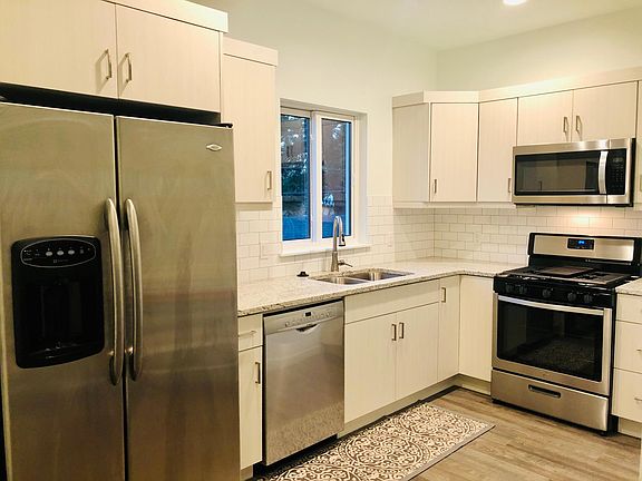 Enjoy the kitchen with granite counters, gas stove, and pantry.