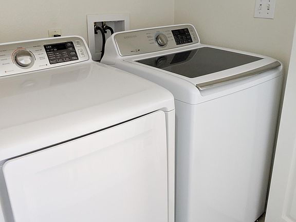in-unit washer/dryer located in upstairs hallway