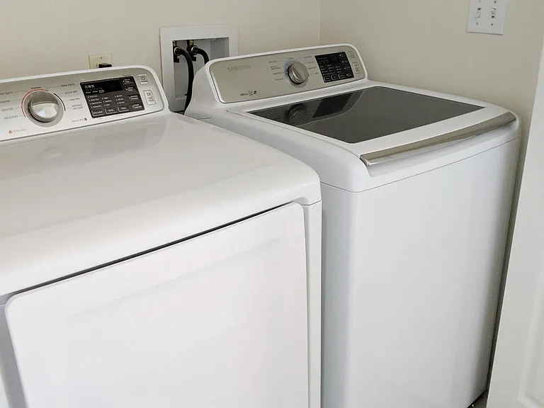 in-unit washer/dryer located in upstairs hallway