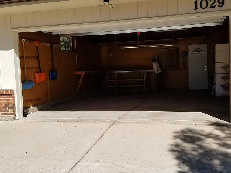 2 car garage with storage and door opener.