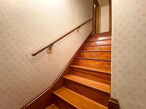 Stairs leading from the front door to the second floor