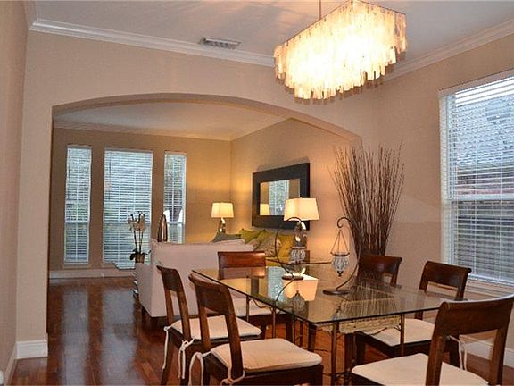 Open concept formals freshly painted a neutral color.