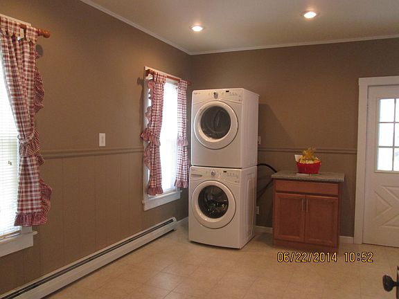 stacked new washer and dryer in first floor