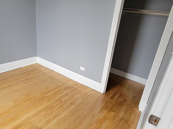 3rd Bedroom with closet towards front of the house. Fan and dimming light included.