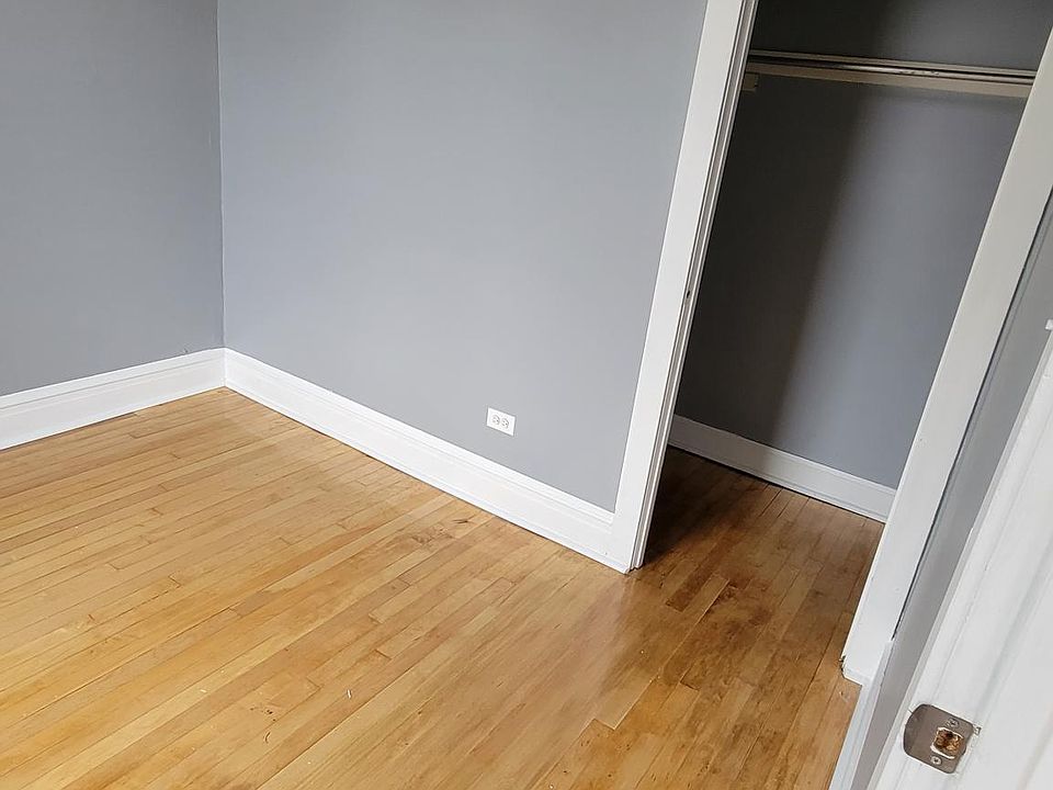 3rd Bedroom with closet towards front of the house. Fan and dimming light included.
