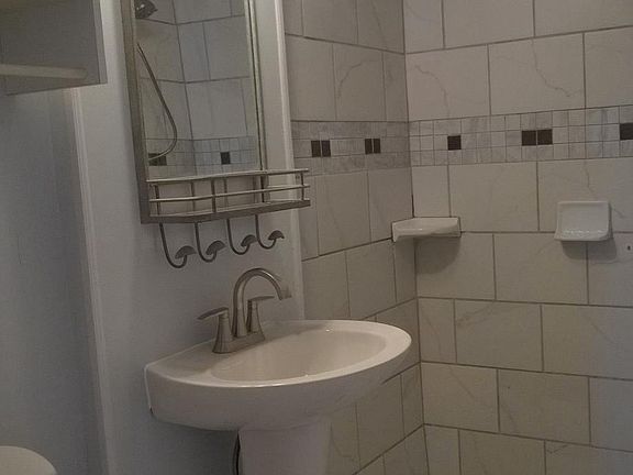 new bath, floor to ceiling tile shower