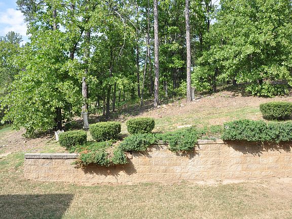 Retention wall backing to private greenbelt