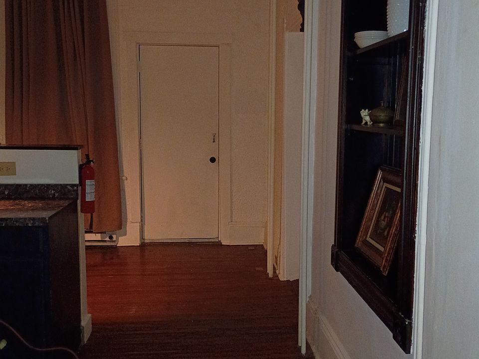 victorian details, hard wood floors, rear door leading to back yard.