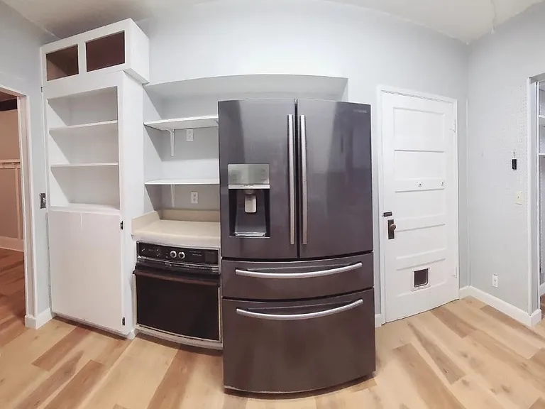 Black stainless steel double/french door and flex drawer refrigerator, included for your use in the rental.