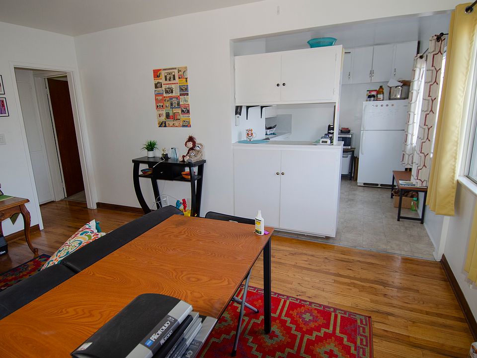 Living room and kitchen view with hallway to left.