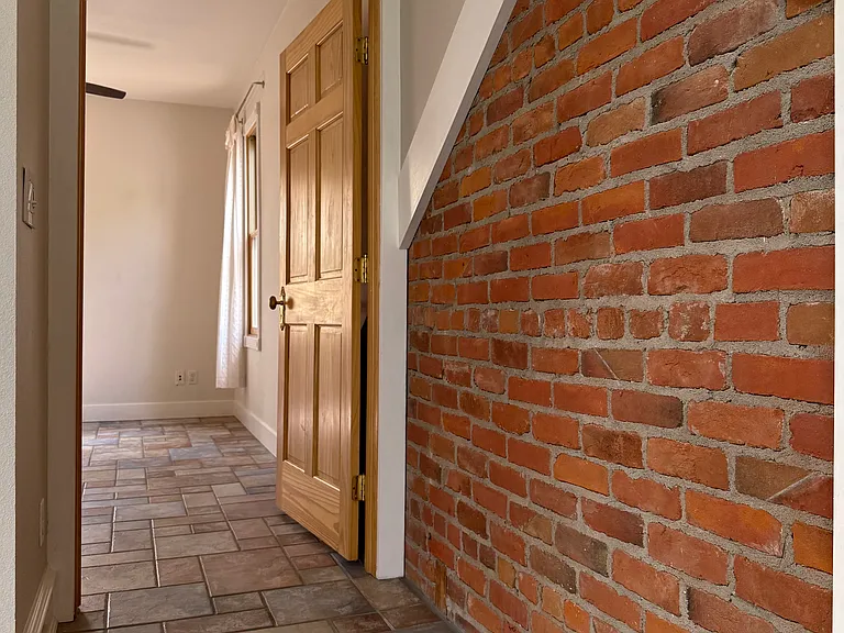 Entrance to upstairs bedroom - brick is the top of the original house
