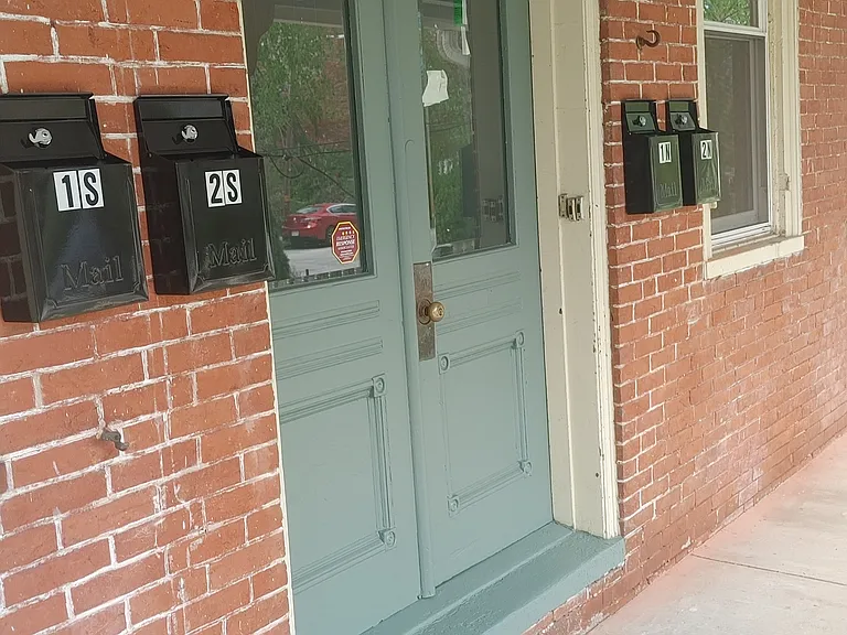 Original front door for the second-floor apartments.