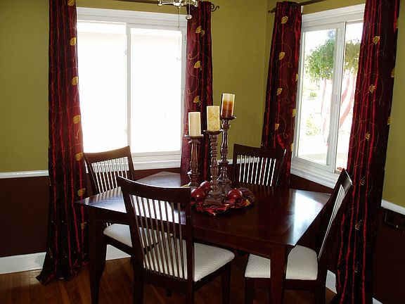 Dining area.  Beautiful paint scheme.  New walls/ceilings/paint throughout.