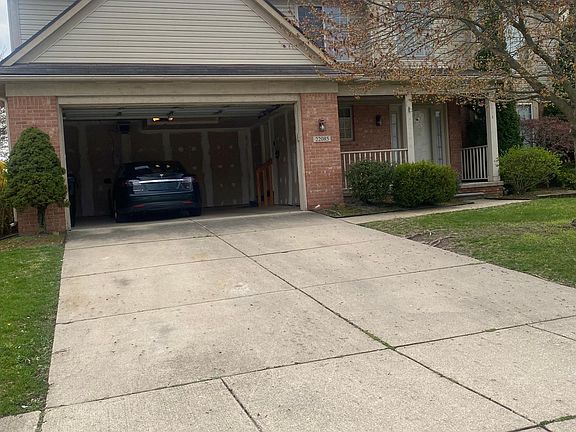 Home Front with garage open