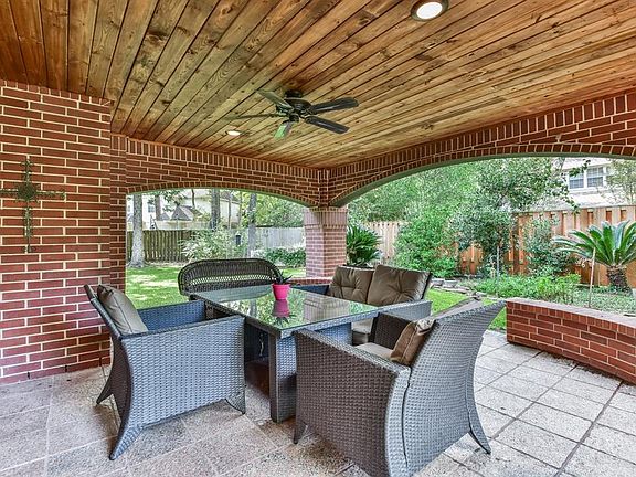A view of the open patio - notice the beautiful hard wood ceiling and the great view of the backyard