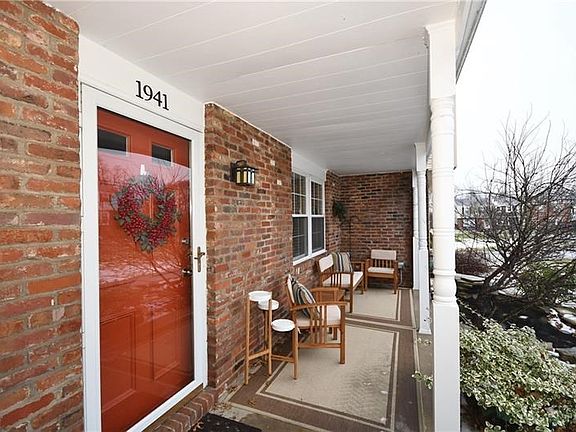 What a lovely front porch to enjoy when the weather turns warmer!