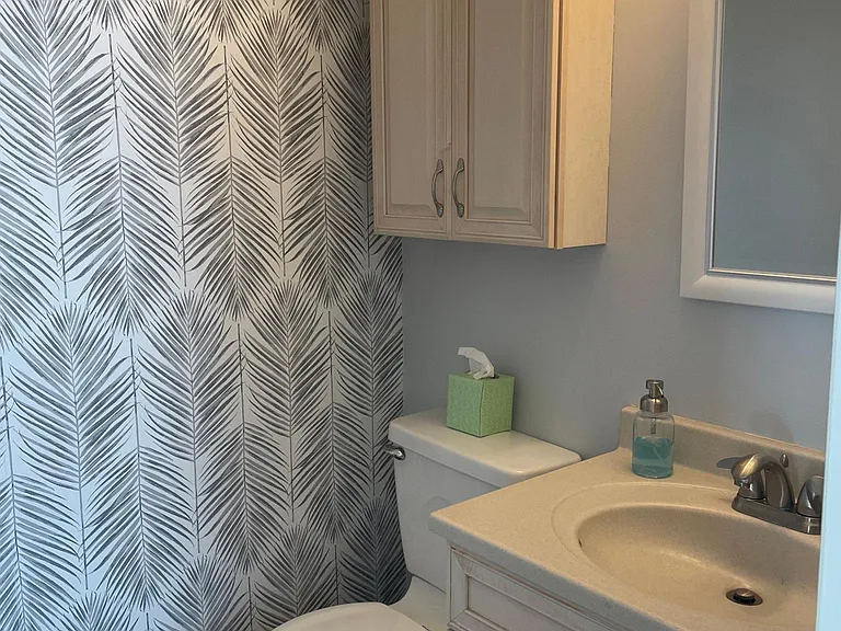 Half bath, located in downstairs hallway