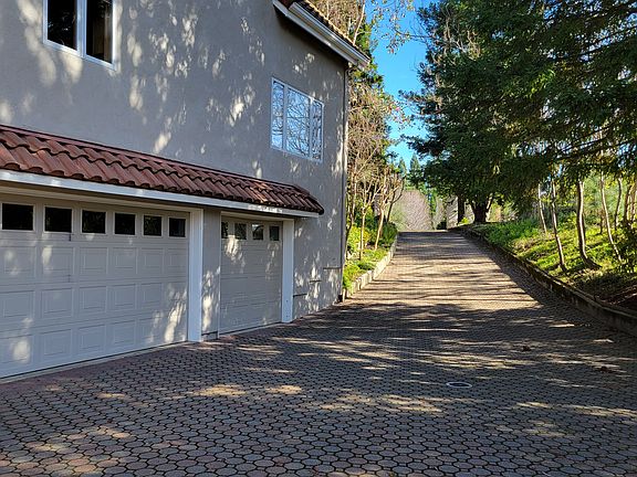 Paving Stone Driveway to three car garage plus extra parking area (not seen)