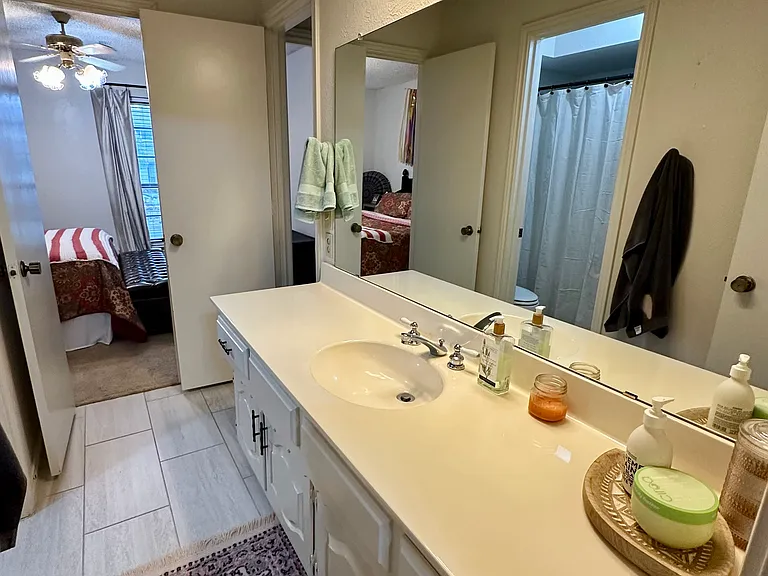 Jack and Jill bathroom with vanity and shower