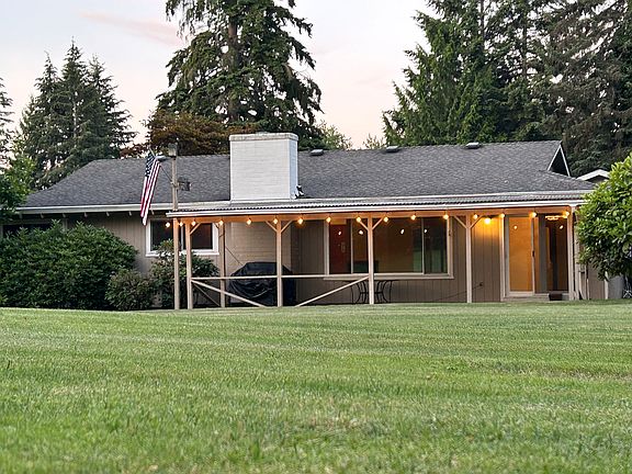 View of back patio with covered patio and outdoor lighting. Perfect for entertaining.