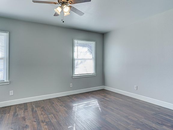 Standing at the master bedroom door.