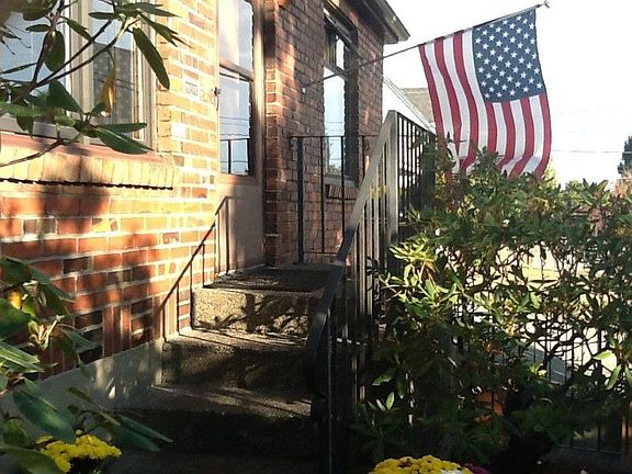Mature plants and blooming flowers greet you at the front door