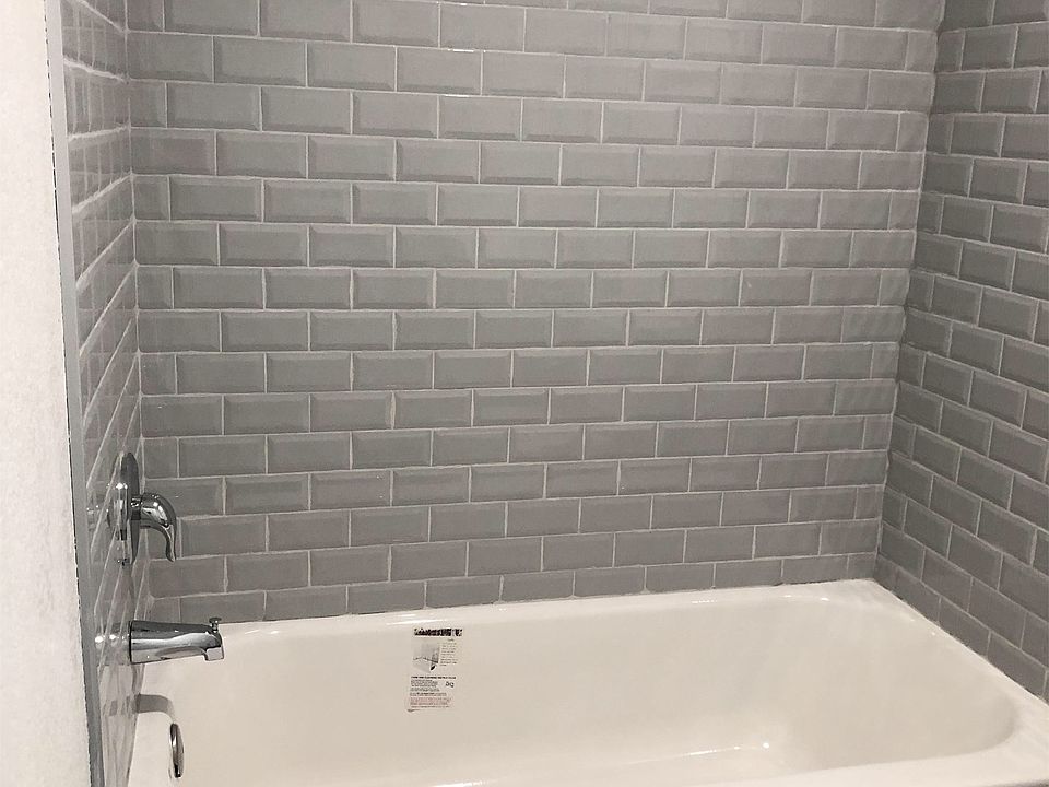 All new tile tub and faucet