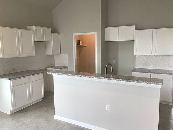 Light Counters and White Cabinets