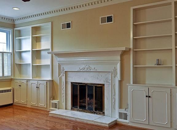 DEN WITH GORGEOUS MARBLE FIREPLACE AND BUILT-IN BOOKCASES