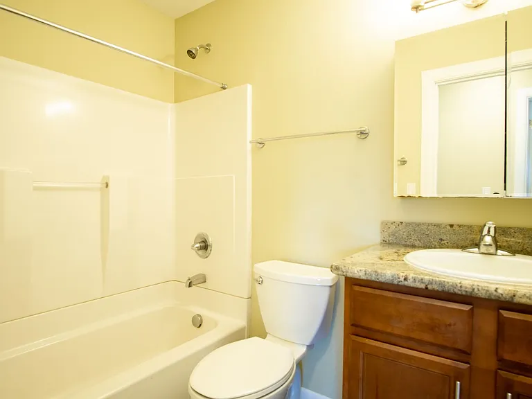 Get 1 Month FREE! Top-Floor 2-Bedroom with Bamboo Flooring + Off-Street Parking! — Photo 16