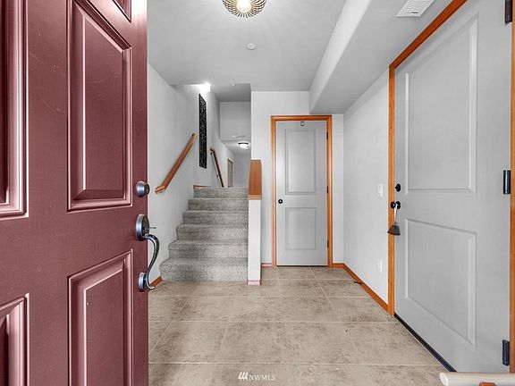 Main Entry holds coat closet, door to garage on the right and staircase to 2nd floor & bonus room (main floor)