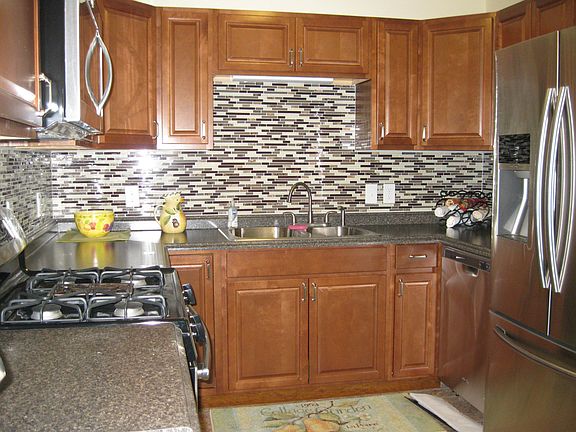 stainless appliances, new glass tile back splash, ready to make your favorite recipe.