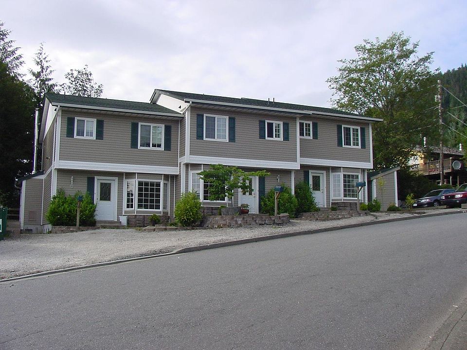 Street view. Unit available is to the far left. Off street parking for two vehicles. Storage shed to left out of picture.