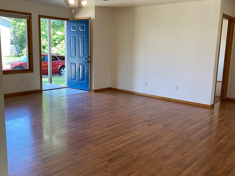 Huge Living Room with Hardwood Laminate Floor and Coat Closet